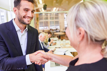 Business people shaking hands as congratulation