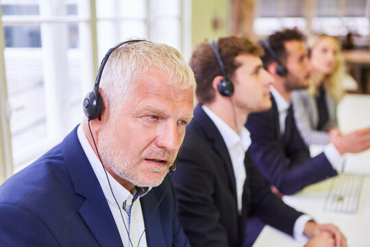 Business people with headset during training in call center