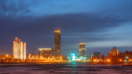 Fototapeta premium Early Spring night on the banks of the pond in the city center
