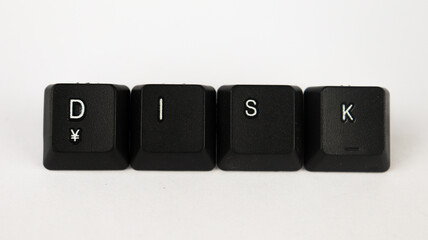 Dısk text created with keyboard keys, isolated on white background, computer terminology