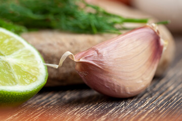 garlic cloves divided into several parts on a cutting board