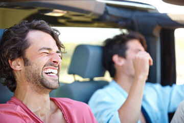 Good times with a great friend. Two friends happy and laughing together while on a drive.