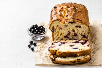 Black currant tea loaf cake. Copy space.