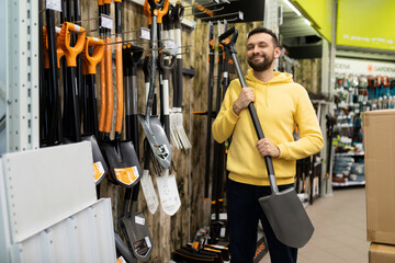 happy customer chooses gardening shovel shop of goods for Gardeners and those who are fond of...