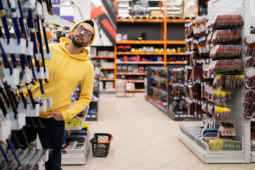 the buyer got lost among the rows of goods in a hardware store