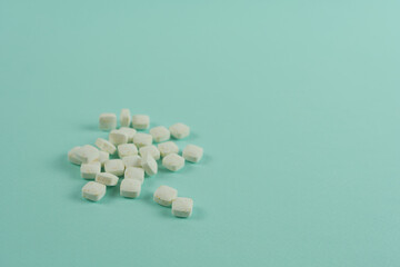 Mint candies on a blue background close-up.