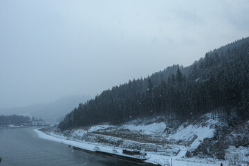 Lake in Ukrainian Carpathian mountains in snowy day