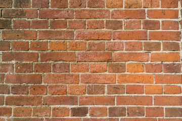 Fototapeta premium Old red brick wall texture. Background of a old brick house.