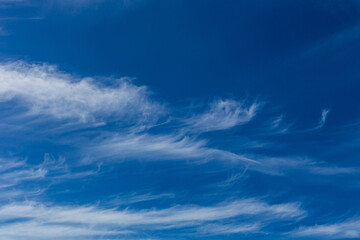 Naklejka na ściany i meble Cirrus and Stratus clouds in dramatic blue sky over Cape Town