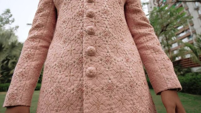 Indian Groom wearing traditional wedding Wear Sherwani Closeup, Fashionable men clothing