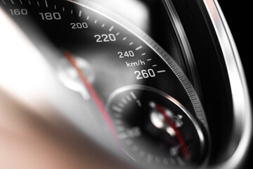 Dashboard with speedometer close-up view. Luxury sport car interior background and wallpaper with bokeh