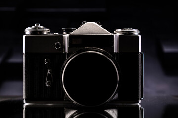 Old film camera on a dark background