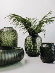 Image of stylish vases, plates and tableware for home. Home interior 