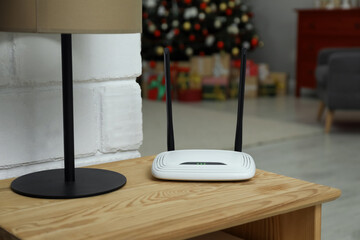 Wi-Fi router on wooden table in room