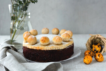 Easter cake simnel for breakfast on a grey background.