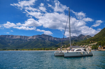 Catamaran sailing in the sea. Cruise on a catamaran at summer
