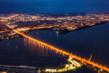 Fototapeta na wymiar Bridge crossing Voronezh river at night