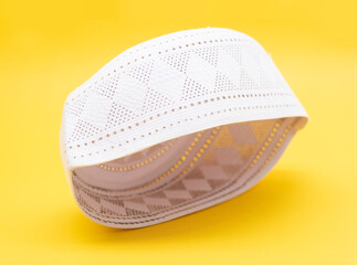 Islamic headdress or or skull-cap usually worn by Muslim men, sometimes it's called as a simple cap or tupi