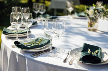 Preparing for an open-air party. Decorated served tables await guests. Decoration Details