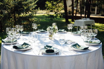 Preparing for an open-air party. Decorated served tables await guests. Decoration Details