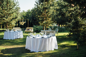 Preparing for an open-air party. Decorated served tables await guests. Decoration Details