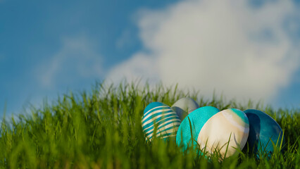 Easter Eggs In Green Grass on a Blue Sky, 3d rendering