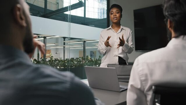 African businesswoman mentor coach boss female leader startup project presentation corporate training explain male investors trainees office study negotiations multiracial business team brainstorming