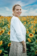 girl in a sunflower field in Ukraine. Stop the war in Ukraine. Happy in Ukraine