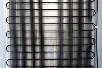 Back wall of the domestic refrigerator with grille - obrazy, fototapety, plakaty
