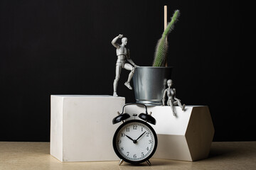 Composition man, woman, cactus, clock and plaster figures.