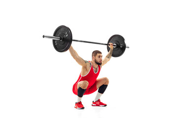 Fototapeta na wymiar Portrait of man in red sportswear exercising with a weight isolated on white background. Sport, weightlifting, power, achievements concept