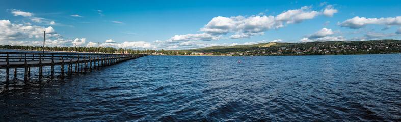 Fototapeta na wymiar Rattvik, Dalarna, Sweden - Extra large panoramic view over the Siljan lake with the pier