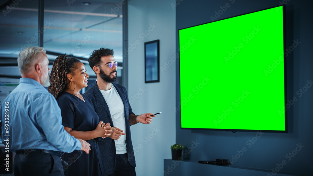 Poster company operations manager holds meeting presentation for a team of executives. adult male uses wide