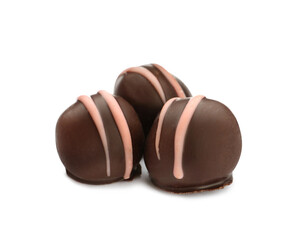Delicious sweet chocolate truffles on white background