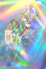 quartz crystal and balls on abstract holographic background close up. spiritual healing crystal practice, Protect from negative energy, uplifting positive spirit, harmony, calming, productive the mind