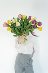 Person holding bouquet of tulips
