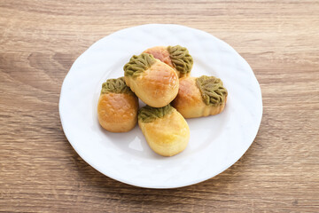 Nastar Cookies, Taiwanese Pineapple Cookies with pineapple-shaped filled with jam. Served on plate.