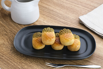 Nastar Cookies, Taiwanese Pineapple Cookies with pineapple-shaped filled with jam. Served on plate.