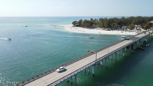 aerial spinning to the north and Coquina Beach and park from Longboat Pass in Sarasota, Florida