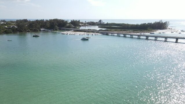 aerial of groups of boaters line the shores at Longboat Pass in Sarasota, Florida