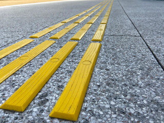 Bright yellow tactile paving for the visually impaired