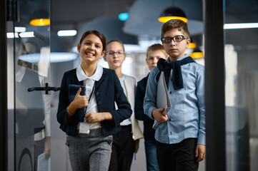 Diverse confident children business group entering office
