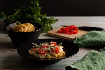 delicious fresh pasta served with white sauce and tomatoes-2