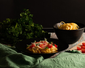 delicious fresh pasta served with white sauce and tomatoes