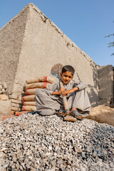Fototapeta premium Poor children are forced to work construction 