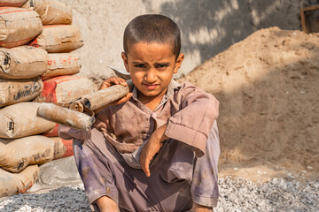 a little boy working on a construction site