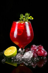 Cocktail drink with crash ice on black background