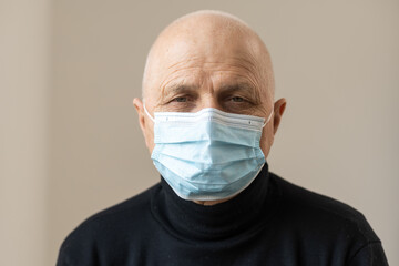 Elderly man at home mask isolation