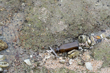 garbage on the beach, dirty sea