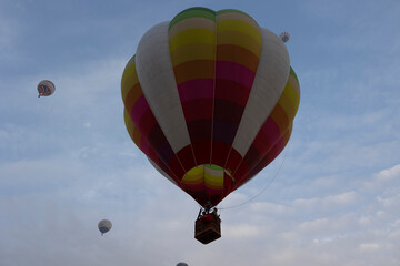 Sunrise balloons in flight over the north west Saudi Arabian desert area of Al Ula